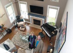 Above: guests gathered in the showhouse living room.   Below, right: Barbara Galazzo, left, and Maryann Syrek in the adult playroom. 