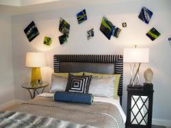 This bedroom features a harlequin theme in shades of green and blue.